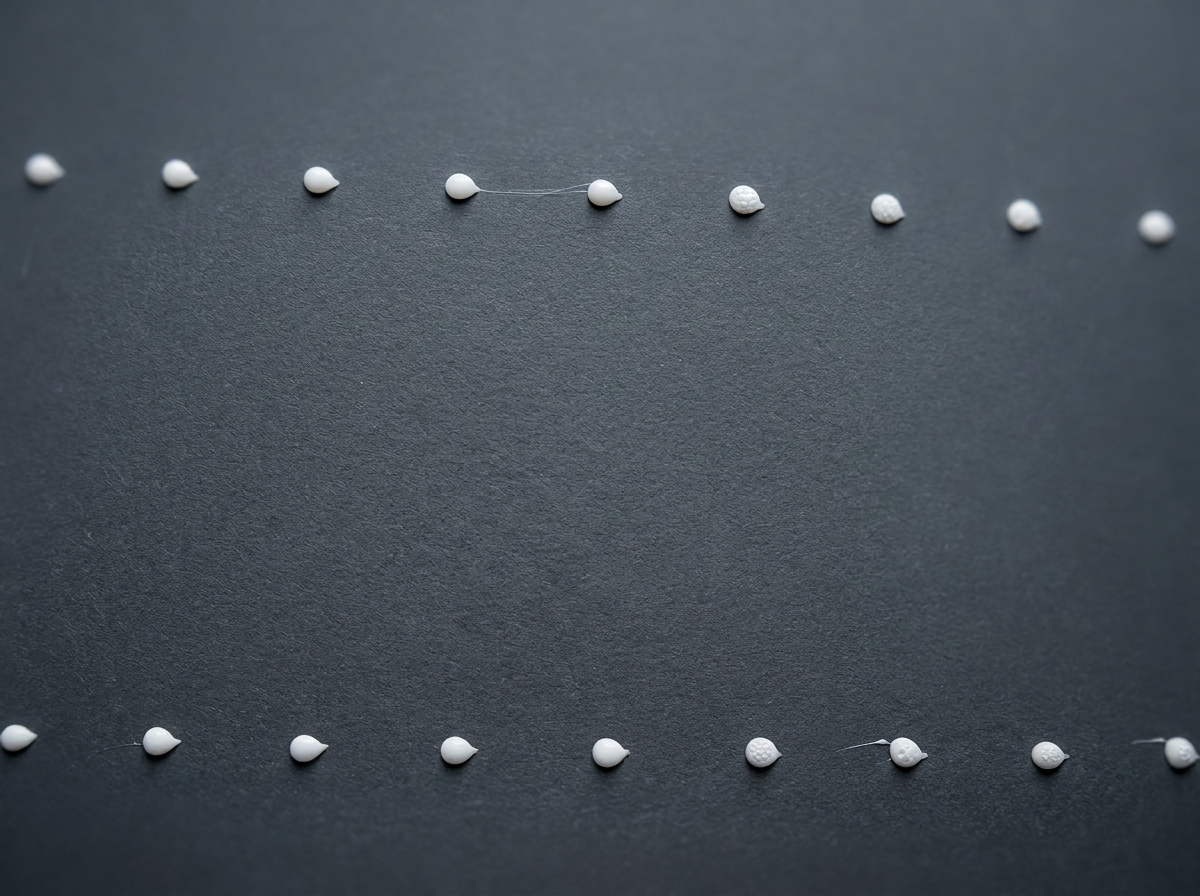 Rows of HOT-MELT adhesive dots laid down by a linear head
